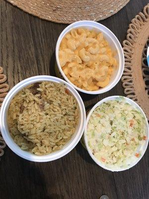 Cajun rice has chunks of sausage in it, Mac & Cheese and coleslaw are the best!!!