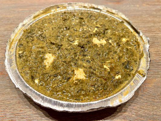 Palak Paneer. Creamy spinach with cubes of Indian cheese. I got this with medium spice, but damn... it seemed more than medium spice!