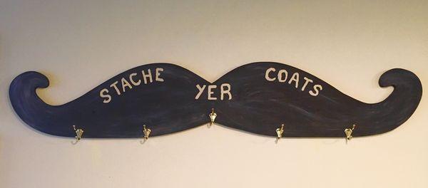 'STACHE YER COATS' on our custom made coat rack