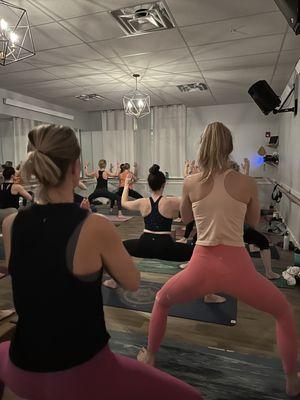 sweat + flow, our heated vinyasa class.