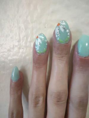 Full set Acrylic, 2 accent design nails, $64. Color Fountain Green.