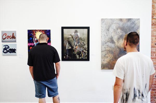 Guests checking out the artwork at the Grand Opening.