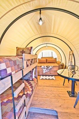 Experience Glamping at its best in the Wild, Wild West! Stay in one of our western-themed Conestoga Wagons!