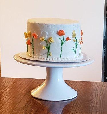 This is a carrot cake - the birthday girl wanted flowers around it, and she absolutely loved this!