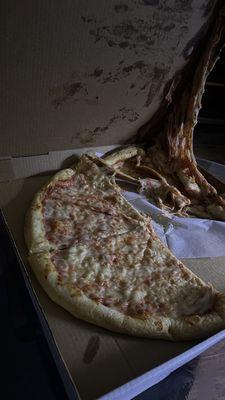 Pizza with half of it stuck to the box from being transported horribly. Undercooked dough that tastes like it was rushed out of the shop.