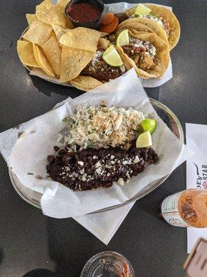 Tacos with side of rice and beans.