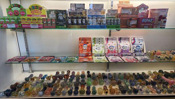 Kratom, different assortment of gummies, and more pipes.