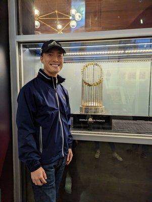 The Atlanta Braves' 2021 World Series championship trophy and championship ring on display at Monument Garden at Truist Park.