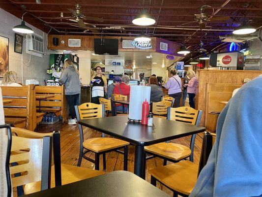 Inside of shop looking towards order/pick up counter. Super small inside, can get crowded, outside tables, decently quick service