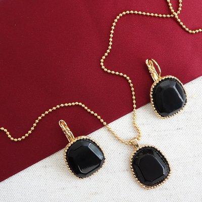 Black onyx set in gold earrings & pendant. Designed by Nature Bijoux