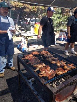 big operation here with 4 large grills on charcoal, tents, misters, etc.