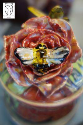 A lovely bee and rose jar