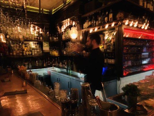 The bar near the front of the venue, before entering a room for the "Magic Hour"