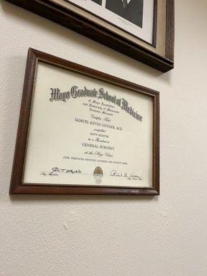 Certificate on wall.