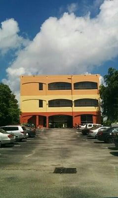 Once you turn off Atlantic and drive under thru the building, there is a steeply sloped parking lot.