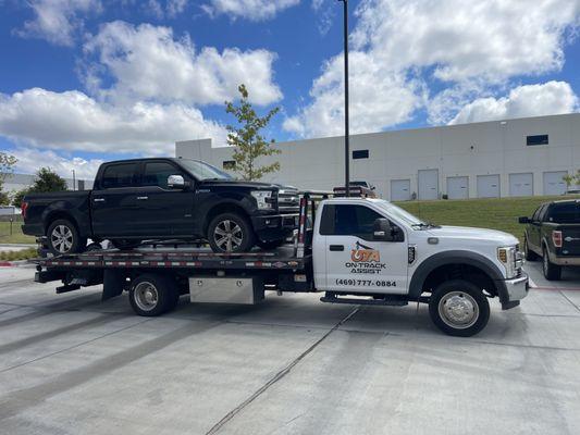 One truck counted on by another! Ontrack Assist Towing to the rescue of a huge black Ford truck