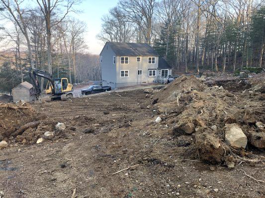 Grading the yard (rear view)