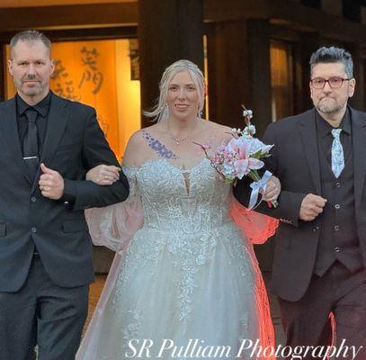 Walking down the aisle with my dad and step dad!