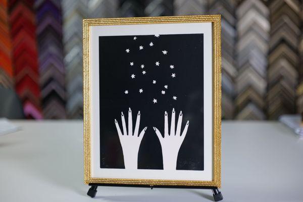 Limited edition print with custom gold studded framing.