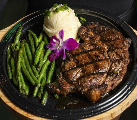 Flame Grilled Steak with your choice of two sides