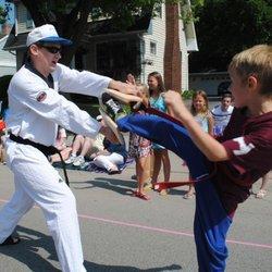 Peyton having FUN breaking boards in Barrington's the 4th of July. parade.