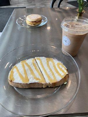 H+C toast with less cream cheese as requested. Breakfast sandwich in back. Iced mocha. Everything was delicious.