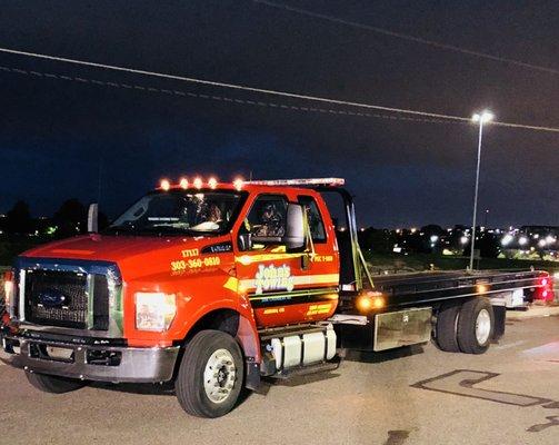 Fleet of new Ford F-650 Flatbeds for damage free towing of light and medium duty vehicles