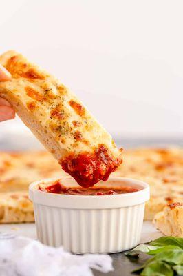 Get ready for cheesy goodness at Bombay Curry Pizza in Coppell! Our Cheese Bread is the perfect blend of flavors.