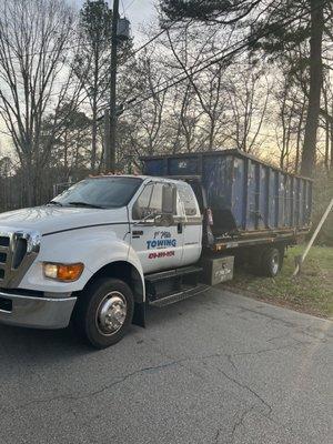 Relocated trash dumpster on builder worksite