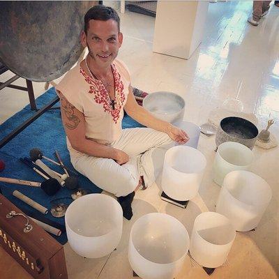 Smiley sound bath musician, Derrick Little at Colony Design in NYC