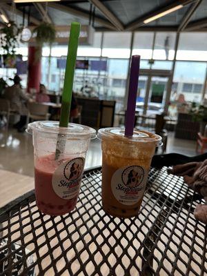 Strawberry tea with popping boba and Thai tea (with almond milk!!) and boba. They're like milkshakes!