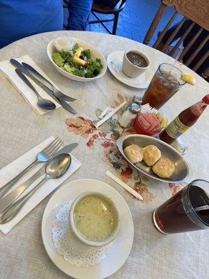 Salad, gumbo,  biscuits, and cream of asparagus soup