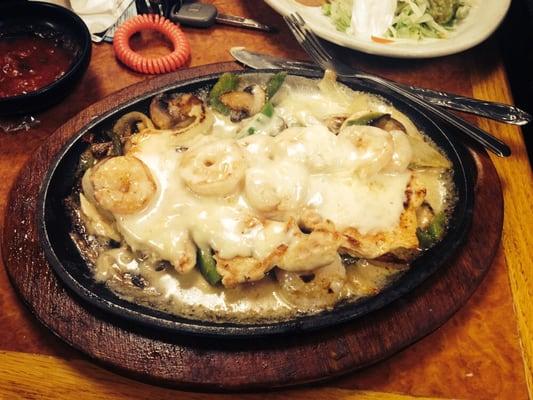 Pollo el venero! Under $10! Chicken breast,onion,mushrooms bell pepper covered  in white cheese with about 6 shrimp!