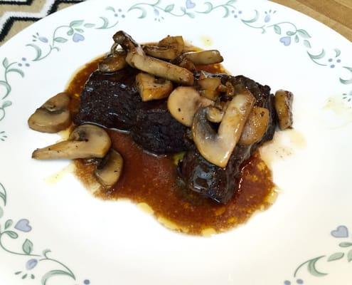 Completed the dish with sautéed mushrooms.