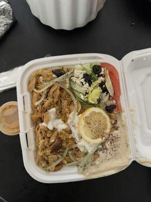 Chicken shawarma, comes with rice, hummus and a salad