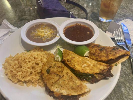 Birria tacos with an added side of rice and beans