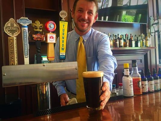 Master Mixologist Regan Gardner serves one of Stacks local draft beers.