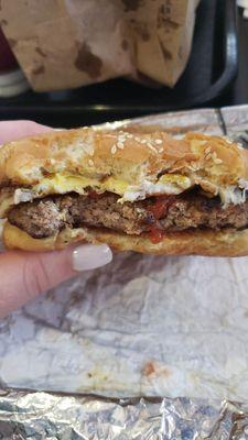 Booyah burger with cheese, fried egg, & a little ketchup. Grilled perfectly & tasted delicious!