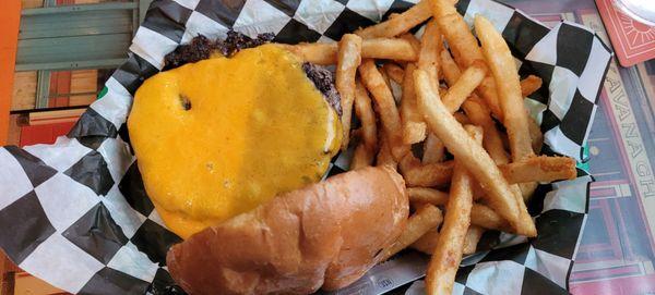 Cheeseburger and fries.  It is a smashed burger