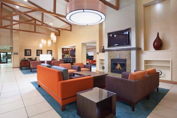 The newly-renovated lobby is highlighted by a cozy fireplace, comfortable lounge seating, and a flat-screen TV.