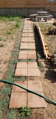 2'x2' "stepping stones" made from Saltillo pavers that connect the two paver pads.