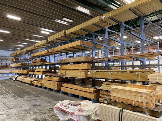 A variety of units of lumber stacked neatly in lumber racks