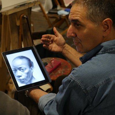 Instructor showing drawings in our studios.