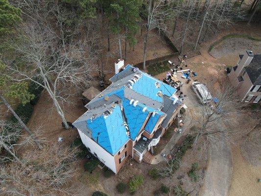 Areal View of Shingles Being Installed