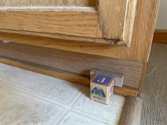 Not sure wtf this was  A childs block glued to a piece of wood glued to cabinet. But yet, this had been "deep cleaned" before moving in