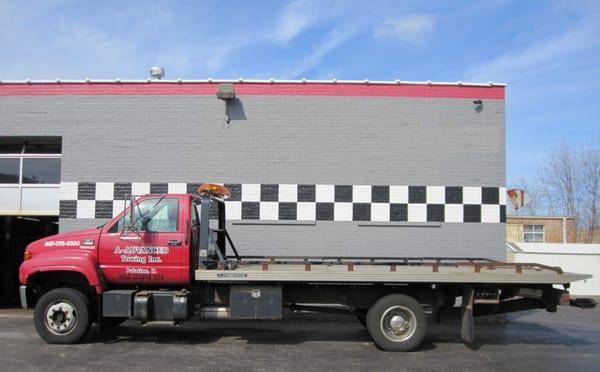 Advanced Auto offers its own flatbed tow truck service