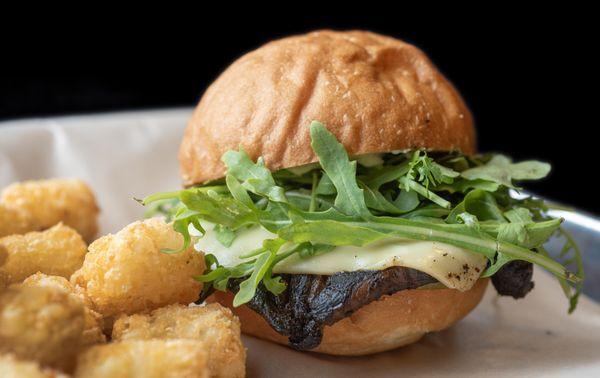 Shroom "burger" with vegan Swiss cheese.