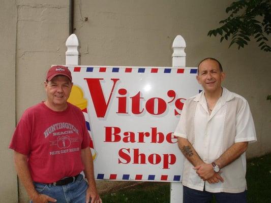 Vito standing outside his Barber Shop in Carlstadt with Coustomer.