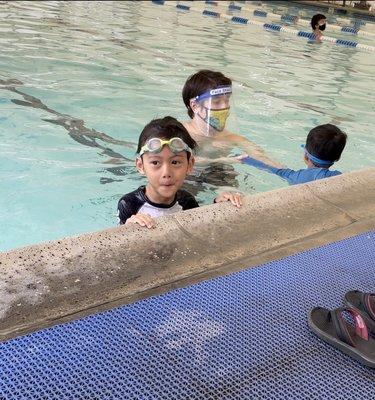 Swim teacher with both kiddos on their first day back.