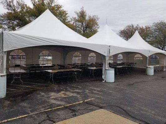 High peak 20 x 60 tent rental with sidewalls, tables and chairs on concrete! This was for a yearly corporate picnic!